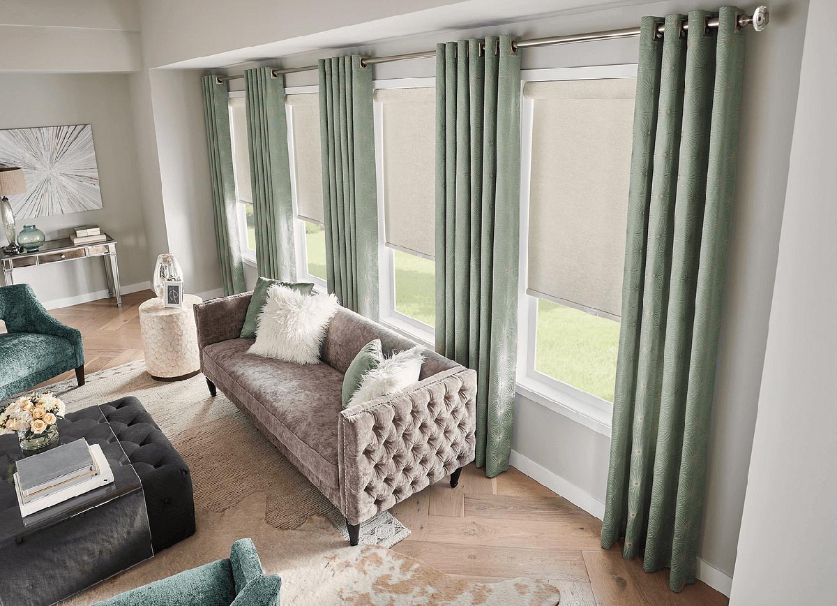 Beautiful-sea-foam-green-fabric-drapes-add-color-and-drama-to-this-living-space
